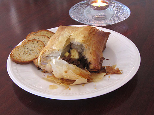 Baked Brie in Phyllo Dough with Caramelized Onions and Cashews baked brie with caramelized onions and cashews