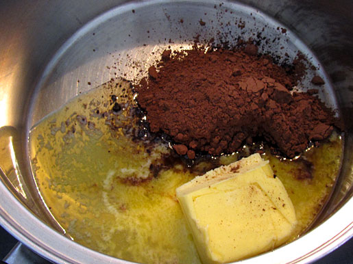 melting butter and mixing cocoa melted butter and cocoa powder